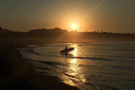 Sunrise Surfer on golden waves